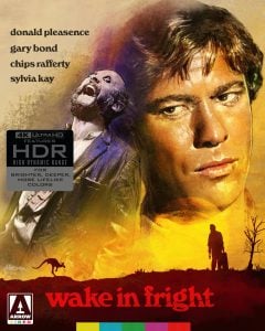 A movie poster for "Wake in Fright" featuring close-up portraits of two men, film credits, HDR logo, and a red-yellow background with silhouettes and the Arrow Video logo.