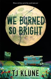 Book cover for "We Burned So Bright" by TJ Klune, featuring a cracked, glowing planet in the sky, a blue RV, a billboard, and colorful fields in the foreground.