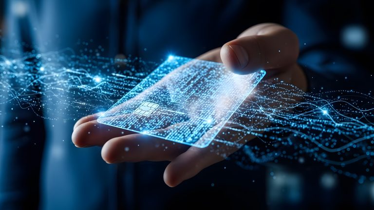 A person holds a transparent, holographic credit card surrounded by glowing digital lines, representing futuristic digital payment technology.