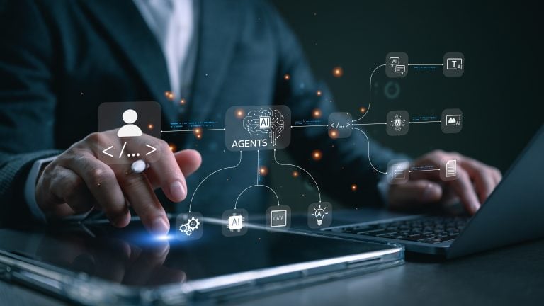 AI Agents Are The New Superheroes And The Founders Building Them Are The Origin Stories Nobody Is Covering Person in business attire uses a tablet and laptop with virtual AI agent icons and data flow graphics overlaid, representing artificial intelligence and automation technology.