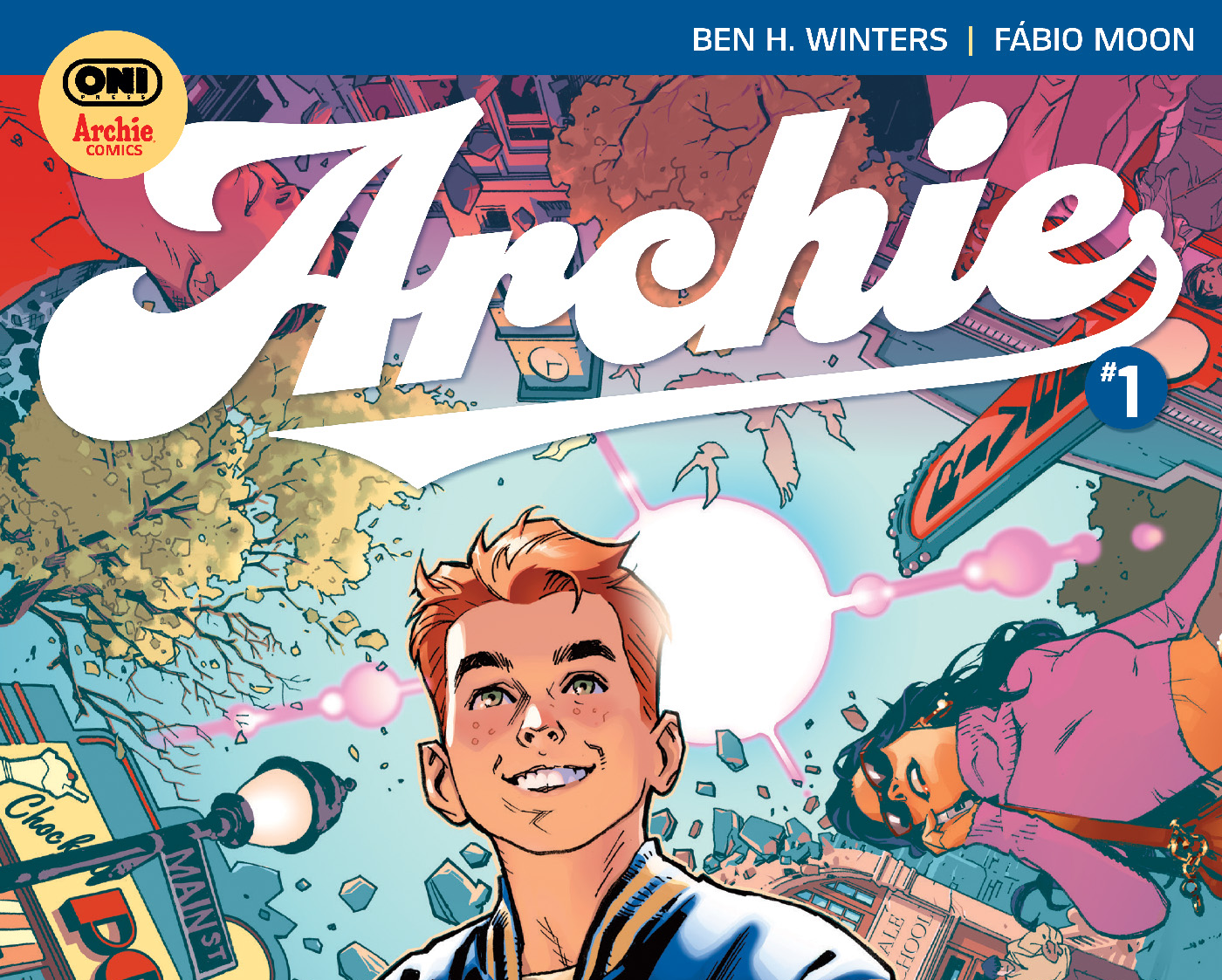 Comic book cover featuring a smiling teenage boy in the foreground, with bright colors, cityscape, and various characters in the background. Title reads “Archie #1.”.