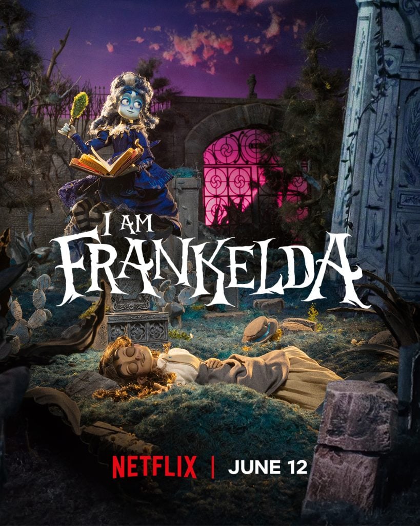 A puppet with blue hair and a book sits on a gravestone, while another lies on the ground below. Text reads: "I Am Frankelda - Netflix | June 12.