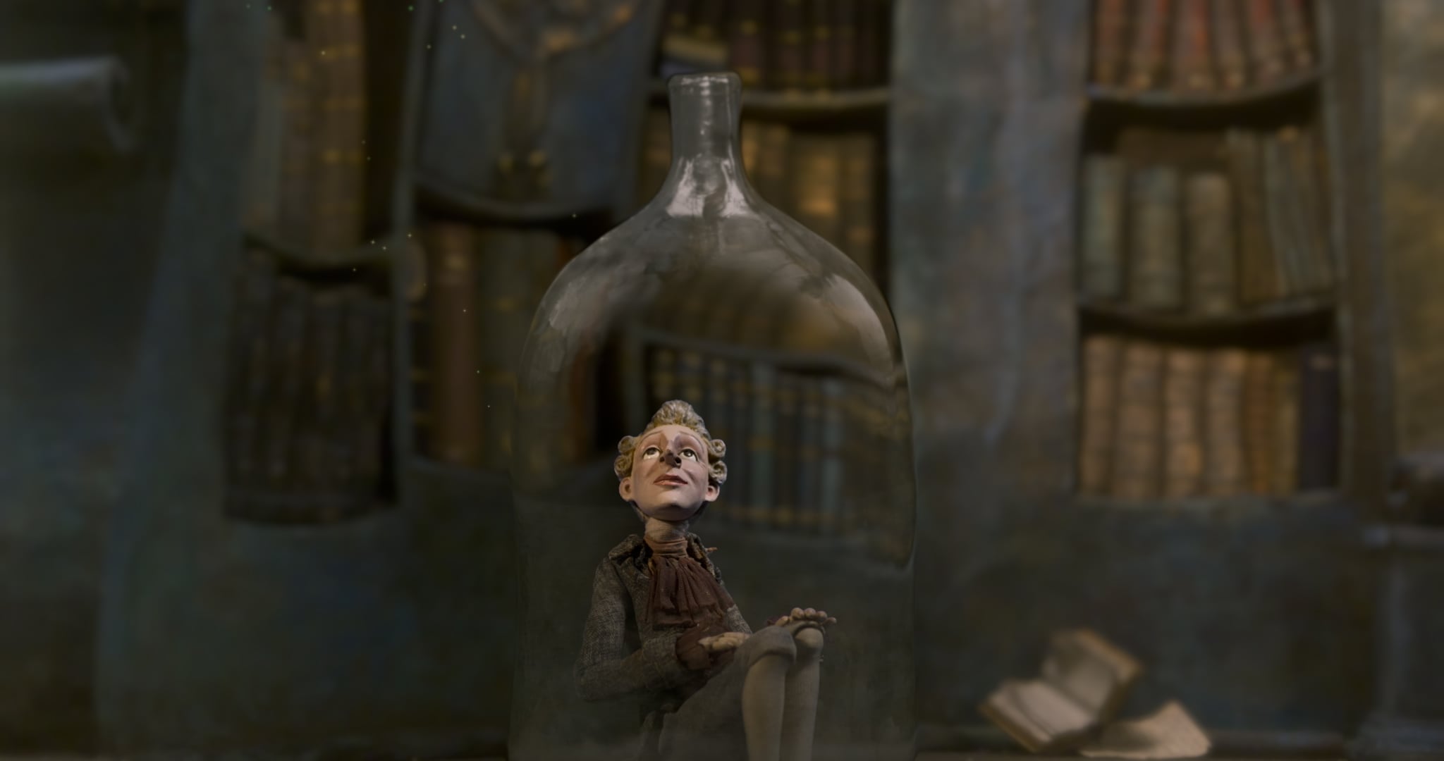 A claymation figure of a person sits inside a glass bottle, with bookshelves filled with books in the blurred background.