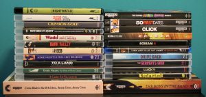 A stack of assorted DVD and Blu-ray movies and TV shows arranged in two columns against a blue background.