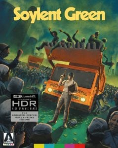 Illustrated movie cover for "Soylent Green" showing a police officer in front of a riot control vehicle lifting people, with a chaotic crowd in the background.