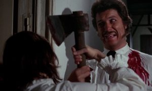 Severin Films Announces Summer Titles Including Terrifying Nuclear War Films, Surreal Genre Box Sets & More A man in a white shirt holds an axe while struggling with another person; his shirt is stained with blood and he appears distressed.
