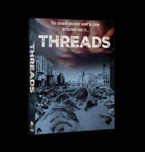 A box for the film "Threads" shows a devastated, post-nuclear war cityscape under a dark sky, with the text, "The closest you ever want to come to nuclear war is... THREADS.