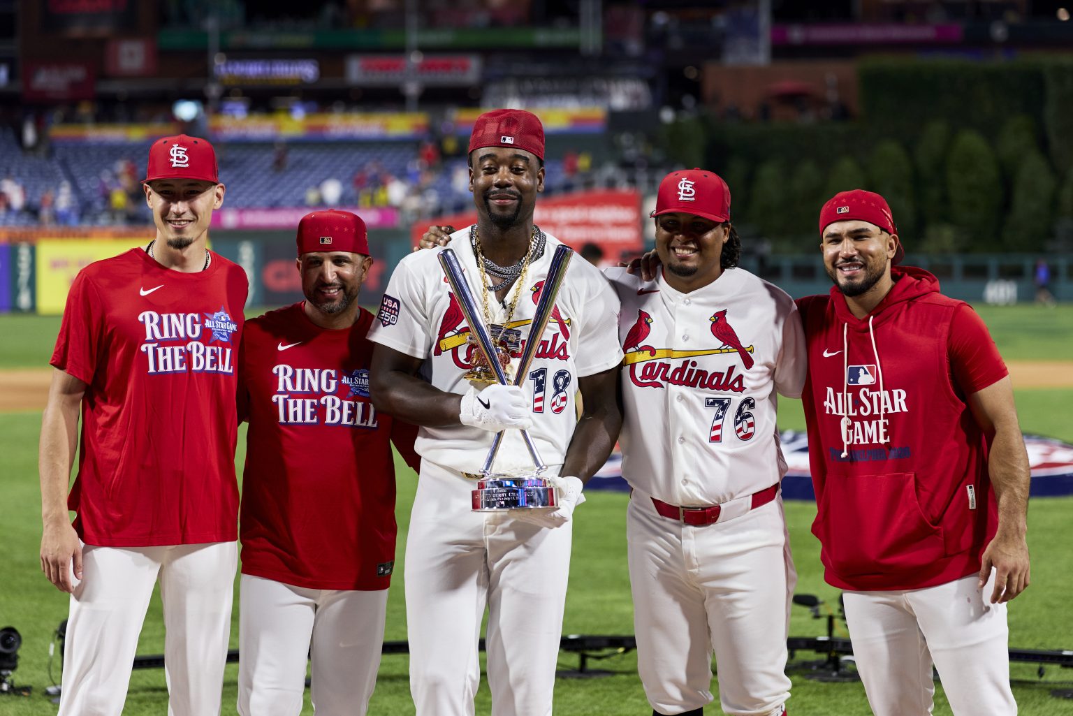 Home Run Derby Five St. Louis Cardinals players pose on a baseball field, one holding a trophy, after the 2022 MLB All-Star Game.