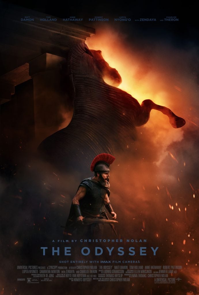 A warrior in Greek armor stands before a large wooden horse, with flames and sparks around them. The text reads, "The Odyssey," and credits the film to Christopher Nolan.