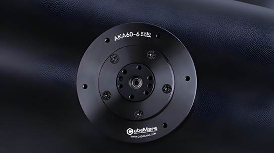Enhancing Mobile Robot Performance With High-Torque Robotic Actuators A round, black metal mechanical part labeled "AKA60-6" and "CubeMars" is shown on a dark textured background.