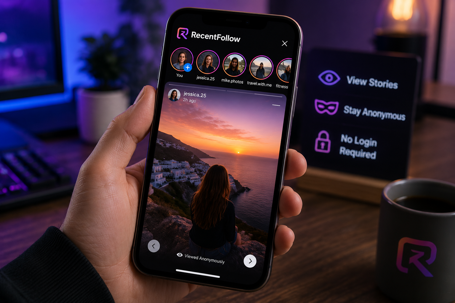 A person holds a smartphone displaying a social media app with a sunset photo, while a desk setup and a branded cup are visible in the background.