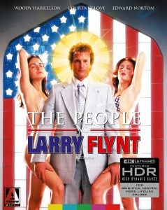 A man in a suit stands between two women in swimsuits, with a glowing halo behind his head, on the cover of "The People vs. Larry Flynt" Blu-ray.