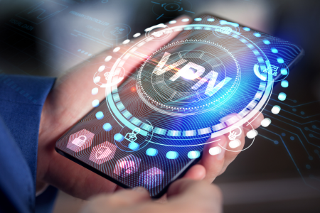 A person holds a smartphone displaying a digital interface with the word "VPN" in the center, surrounded by technology and security icons.