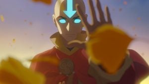 Animated character with glowing blue eyes and an arrow on his forehead holds up his hand, surrounded by swirling yellow leaves against a blurred background.