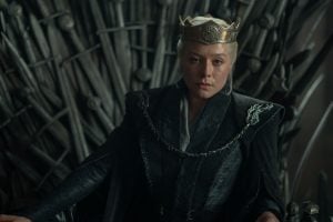 ‘House of the Dragon’ Season 3 Episode 3 Review: Ruling is Harder Than It Looks A woman wearing a crown and dark robes sits on a throne made of swords, looking forward with a serious expression.