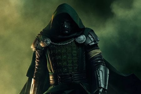 MCU Timeline Explained: Here’s Exactly What To Watch Before Avengers: Doomsday A figure in a green hooded cloak and metallic armor stands against a smoky, dark background, facing forward with a serious expression.