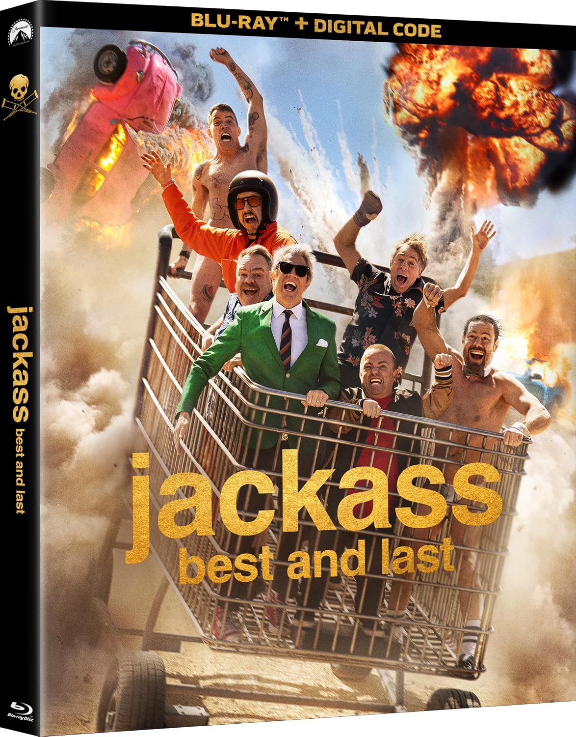 Six people ride in a giant shopping cart amid explosions, with one person in a green suit and others cheering, on the cover of “jackass: best and last” Blu-ray.