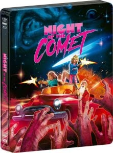 Two women stand on a red car aiming guns at zombie hands, with a cosmic sky in the background and the title “Night of the Comet” in bold letters above.