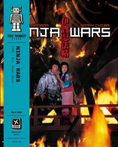 Two people in traditional Japanese clothing stand among flames in a dramatic scene from the movie “Ninja Wars.” The Blu-ray cover features bold text and a vertical blue banner on the left.
