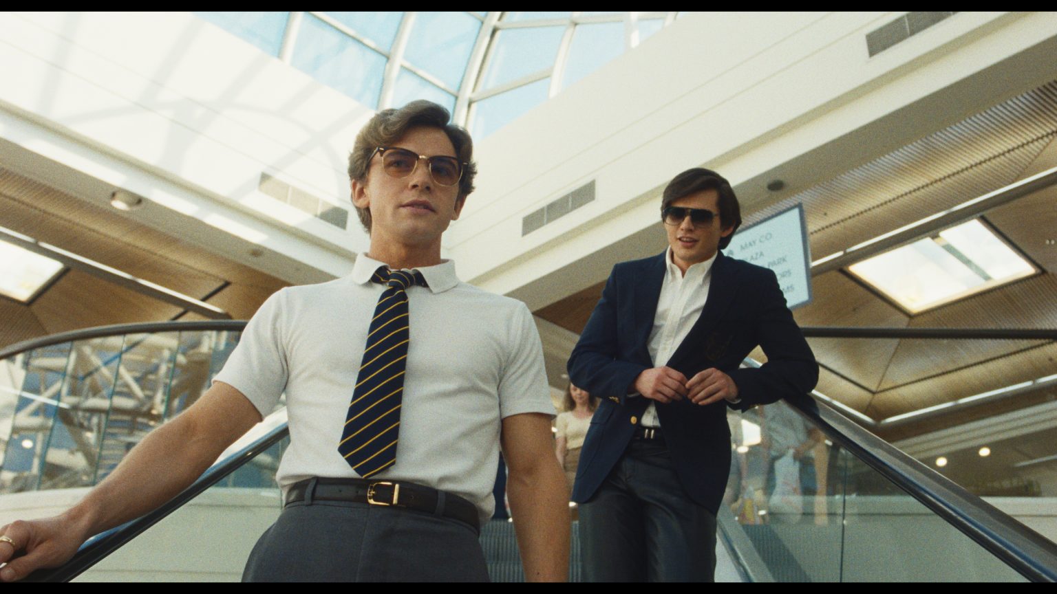 ‘The Shards’ Season 1 Review – A Delicious And Provocative Thriller The Shards Two men ride an escalator in a modern mall, one in a white shirt and tie in front, the other in a blue jacket behind, with sunlight streaming through the glass ceiling.