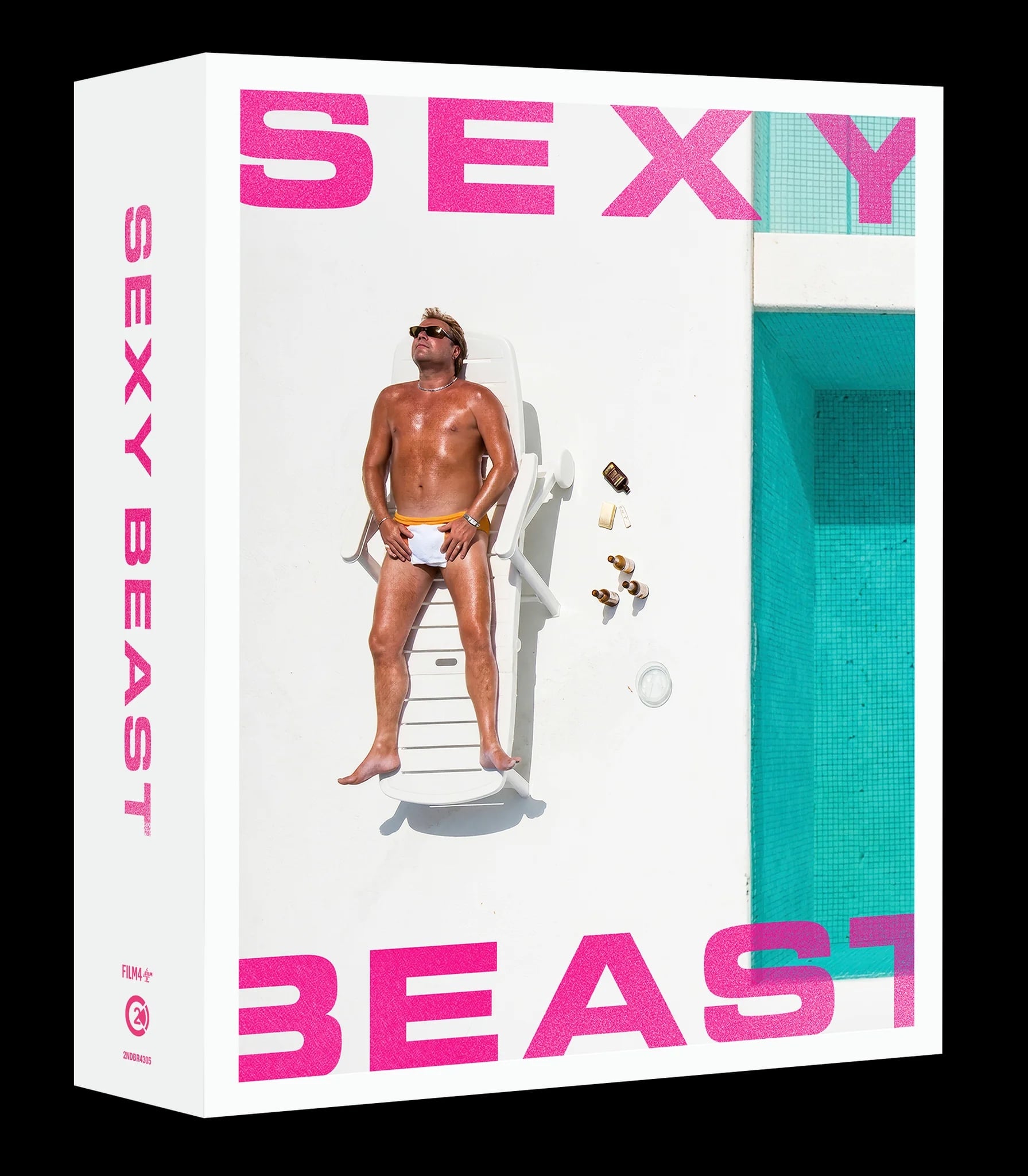 A man in swim trunks lies on a poolside lounge chair with sunglasses and beer bottles nearby. The words “SEXY BEAST” appear in large pink text above and below.