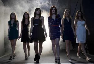 Lionsgate To Release The Horror Remake ‘Sorority Row’ On 4K UHD Blu-Ray This September Six young women walk confidently toward the camera in a smoky, dimly lit room, all wearing dresses and heels.
