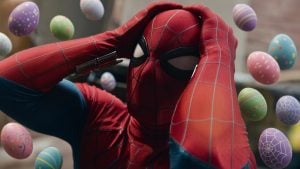 Spider-Man: Brand New Day Hid More Easter Eggs Than You Probably Noticed Spider-Man holds his head in frustration while surrounded by floating decorated Easter eggs.