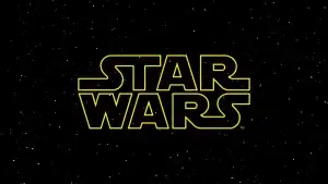 Scrapped Star Wars Movie From Paddington 2 Creators Is Being Reworked Into An Original Sci-Fi Film The “Star Wars” logo in yellow outline appears against a black star-filled space background.