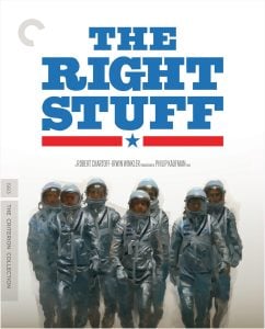 Seven astronauts in silver suits stand together in front of a white background with the title “The Right Stuff” in bold blue letters above them.