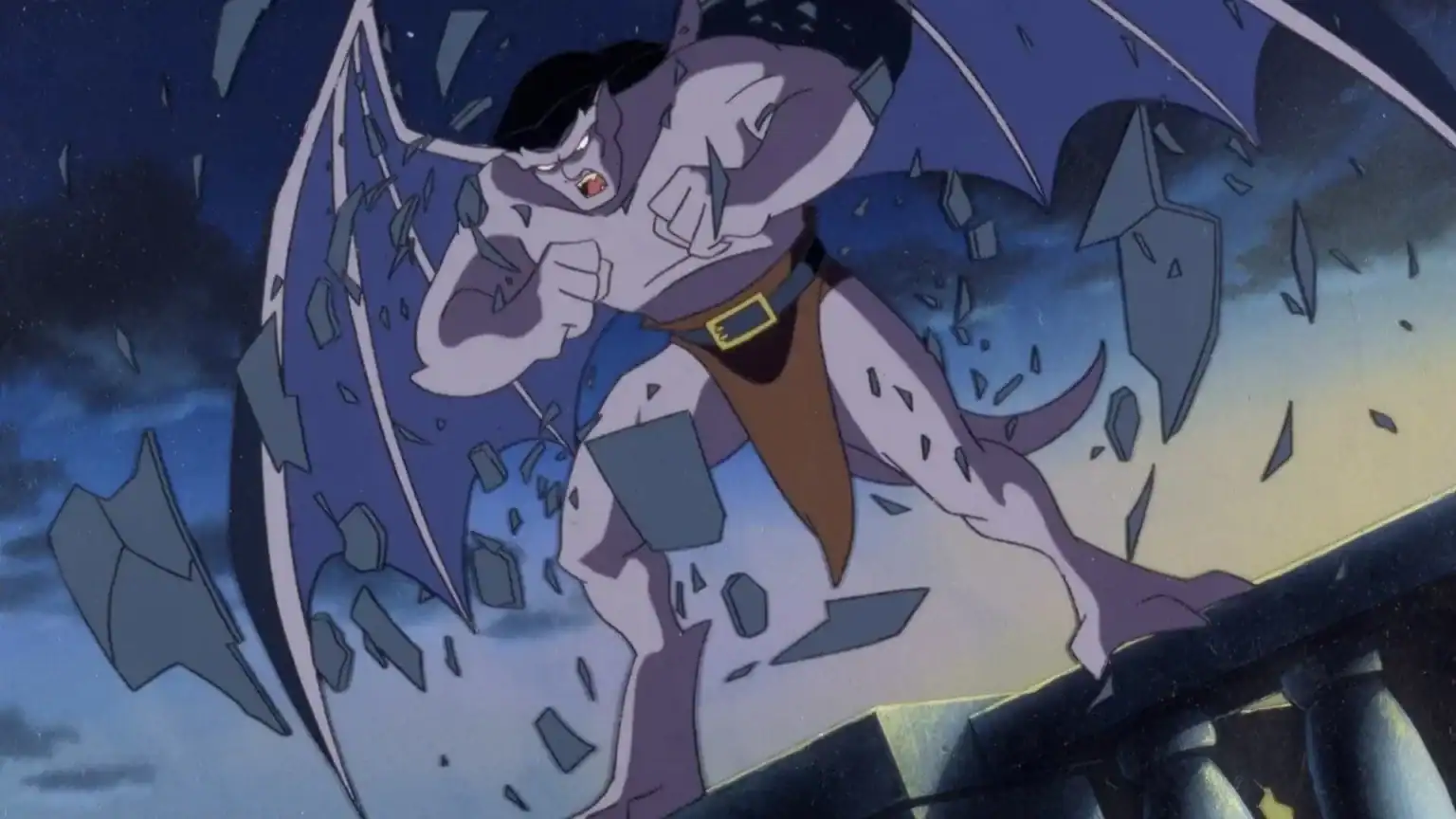 A winged gargoyle breaks free from stone as shards fly around, standing on a rooftop at night under a dark sky.