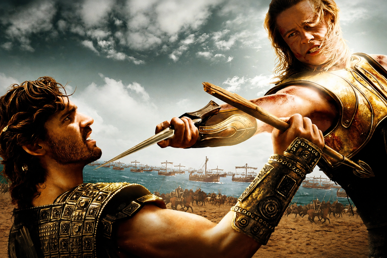 Where Were Achilles And Hector During The Odyssey? Their Fates Explained Two armored men are engaged in an intense sword fight near a beach with ships and soldiers in the background under a cloudy sky.