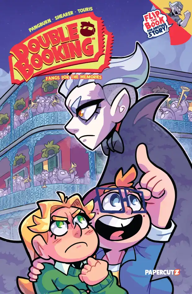 Two children stand frightened in front of a stern vampire on a balcony, with a cheering crowd of monsters visible in the background. The comic book title “Double Booking” appears at the top.