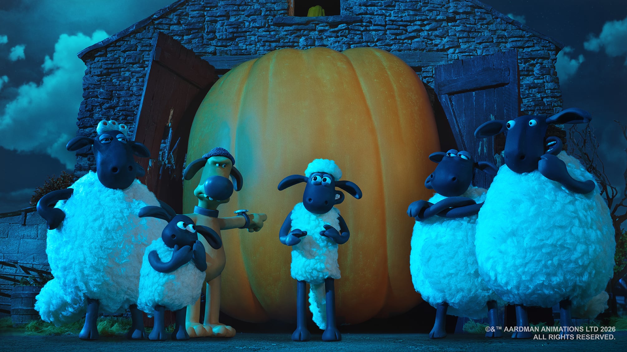 A group of animated sheep and a dog stand in front of a large pumpkin outside a barn at night.
