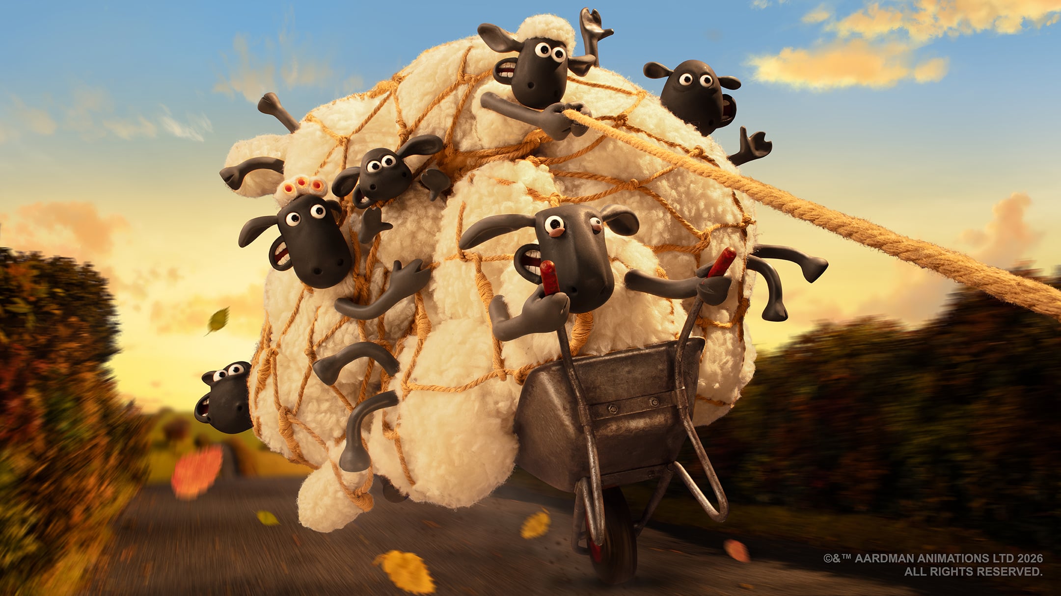 A sheep pushes a wheelbarrow overloaded with fluffy sheep tied together, while others hang on. The scene is on a road with autumn leaves and hedges at sunset.