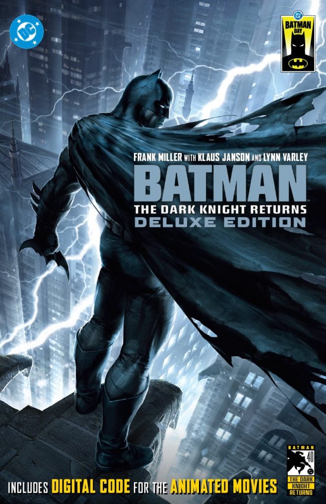Batman stands on a rooftop overlooking a city at night with lightning in the sky. The text promotes “Batman: The Dark Knight Returns Deluxe Edition” and includes a digital code for animated movies.