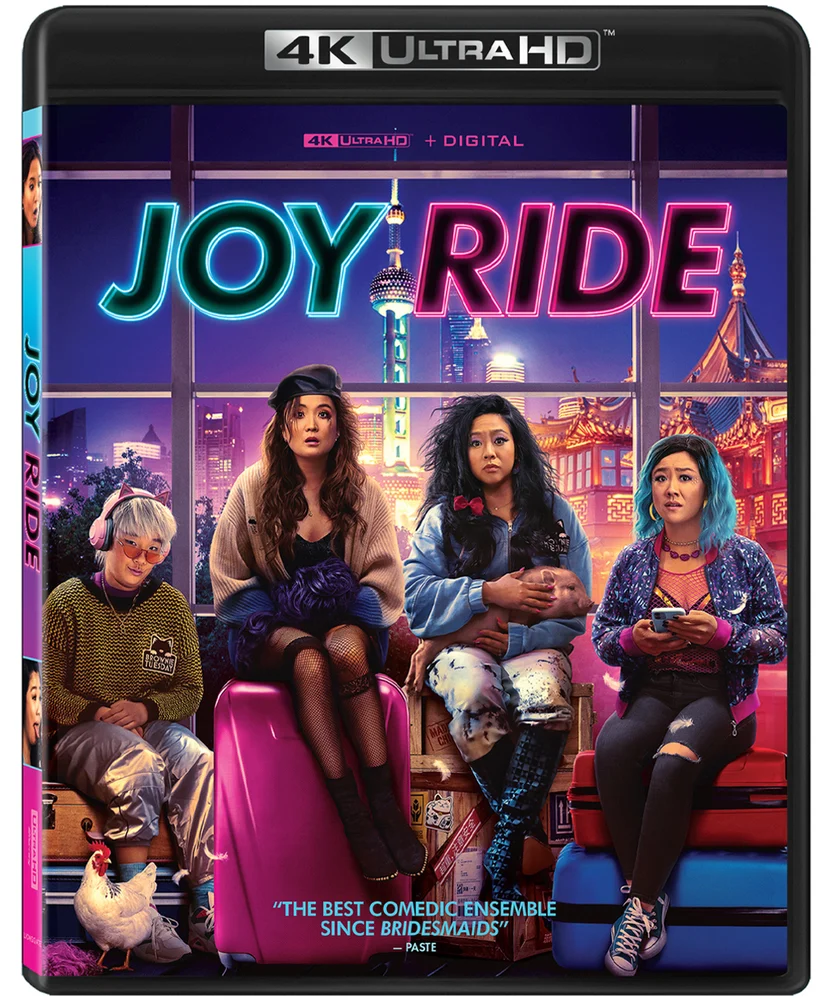 4K Ultra HD Blu-ray cover for the movie Joy Ride featuring four friends sitting on luggage in front of a city skyline.